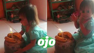 Su sonrisa lo dice todo: padres de familia improvisan “pastel” de cumpleaños para su hija con dos plátanos y una vela