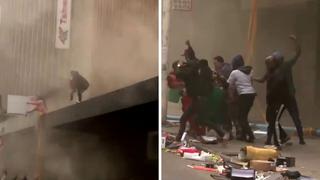 Señora arroja a su hija a un grupo de personas para salvarla de un edificio en llamas