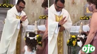 La divertida reacción de una niña cuando un sacerdote le quiere dar la ‘bendición’ | VIDEO