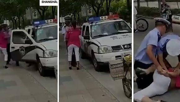 Facebook: policía de Shanghái agrede brutalmente a mujer con su bebé en brazos (VIDEO)