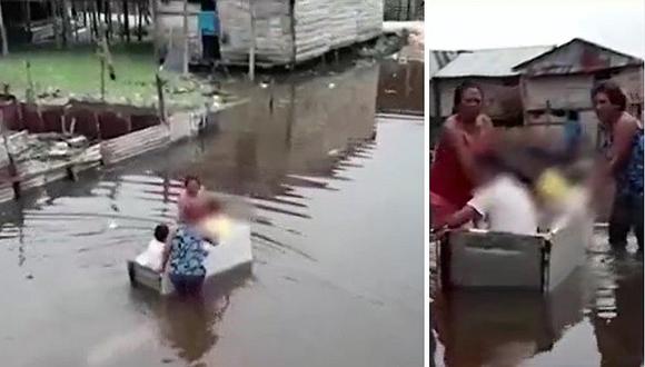 ​Iquitos: refrigeradora malograda es usada como canoa para trasladar a niños (VIDEO)