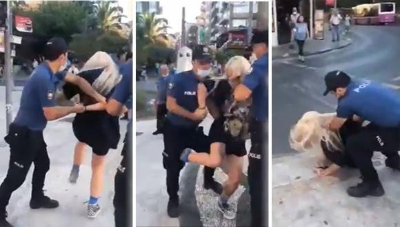 Policías forcejean con mujer y la lanzan al suelo por no usar mascarilla | VIDEO