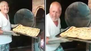 Posaba contento con su pizza, no se percató que lo estaban grabando y sufre las consecuencias (VIDEO)