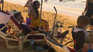 Coronavirus: Turista es captado tomando sol y con tanque de oxígeno | FOTO