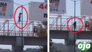 Hombre baila sobre puente peatonal y se desliza por poste de luz | VIDEO