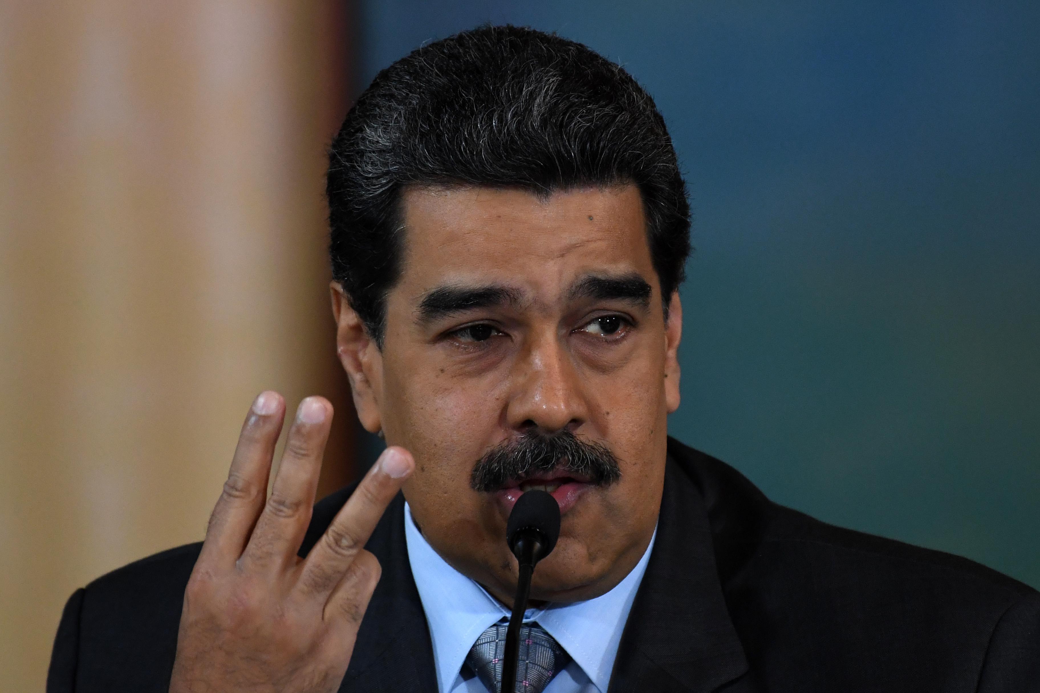 Venezuelan President Nicolas Maduro speaks during a press conference in Caracas on September 30, 2019. - Virtually all countries sent diplomats to the United Nations for the General Assembly last week, but Venezuela was a special case -- it had two delegations, each dueling for recognition. (Photo by YURI CORTEZ / AFP)