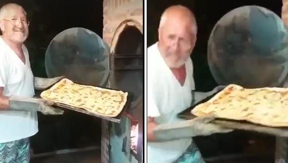 Posaba contento con su pizza, no se percató que lo estaban grabando y sufre las consecuencias (VIDEO)