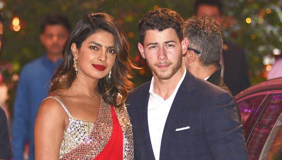 Indian Bollywood actress Priyanka Chopra (L) accompanied by Nick Jonas arrive for the pre-engagement party of India's richest man and Reliance Industries Limited Chairman, Mukesh Ambanis eldest son Akash Ambani and fiancee Shloka Mehta in Mumbai on June 28, 2018. / AFP PHOTO / SUJIT JAISWAL