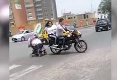 Pareja en moto arrastra coche de su bebé en avenida de Trujillo | VIDEO
