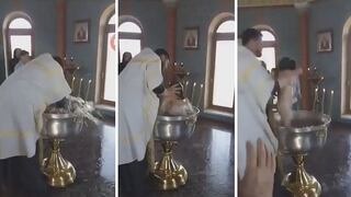 Otro sacerdote bautiza violentamente a bebé (VIDEO)