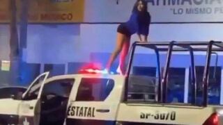 Mujer se sube a techo de patrullero y baila “reggaeton” (VIDEO)