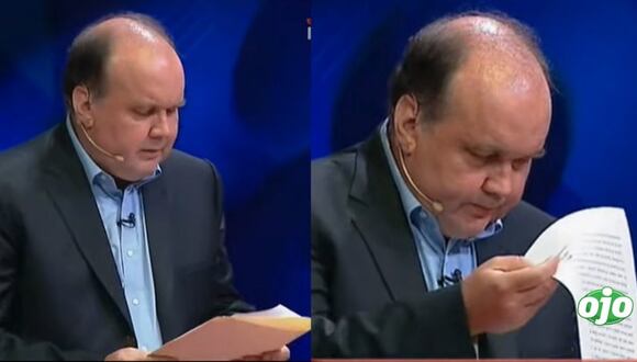 Rafael López Aliaga leyendo durante el debate | diario OJO