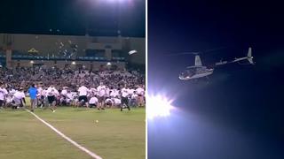 Dueño de equipo de fútbol arroja 10 mil dólares en billetes desde helicóptero como regalo a hinchas | VIDEO