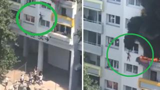 El preciso instante en que dos niños se lanzan de edificio para escapar de incendio | VIDEO