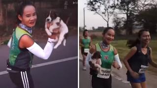 Mujer se detiene en plena maratón para recoger un perrito abandonado (VIDEO)